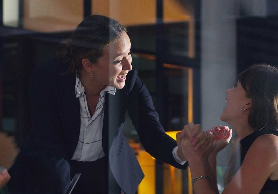 Commercial Banker greeting their client.